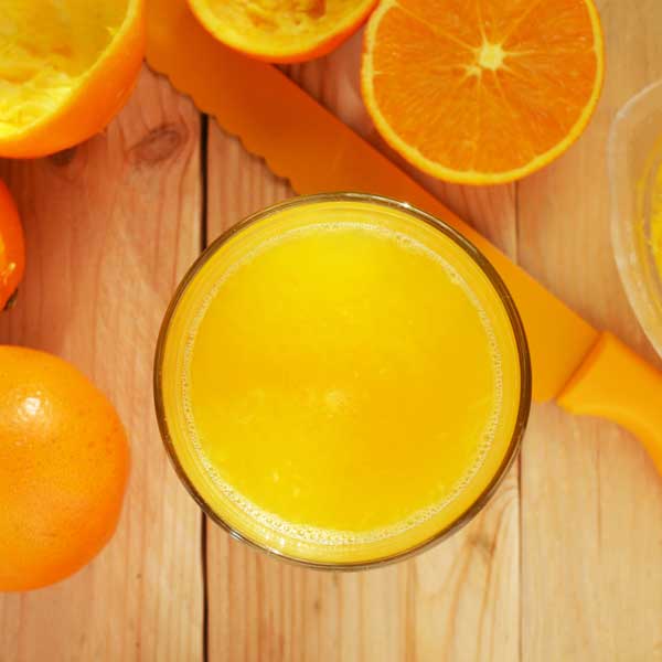Cut oranges and fresh orange juice