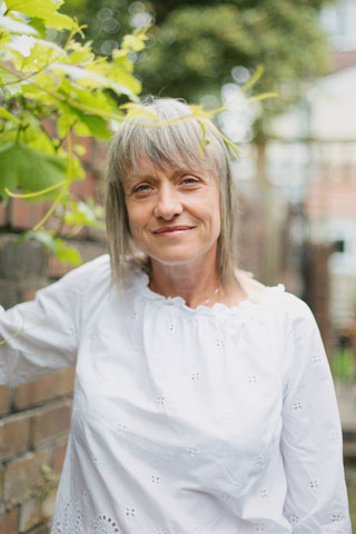 Jan Davidson: Kinesiology, Naturopathy & Nutrition - portrait photo in garden